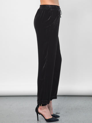 Go velvet everyday pants - Hand wash or dry cleanable 82% rayon and 18% silk velvet pull on mixed pants with silk drawstring cord at waist with self tassel. It has an elastic waistband that sits just below the natural waist with a 9 inch rise. It has front slit pockets with a tapered leg and cuffed hems, its at a 25 inch inseam based on a size small.