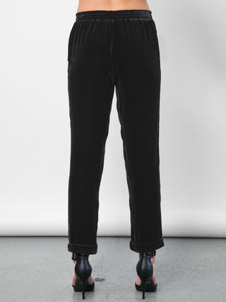 Go velvet everyday pants - Hand wash or dry cleanable 82% rayon and 18% silk velvet pull on mixed pants with silk drawstring cord at waist with self tassel. It has an elastic waistband that sits just below the natural waist with a 9 inch rise. It has front slit pockets with a tapered leg and cuffed hems, its at a 25 inch inseam based on a size small.