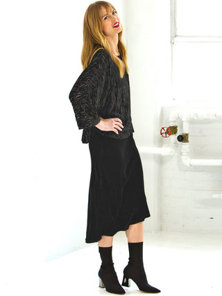 Go velvet underground skirt - Machine washable 82% rayon and 18% silk washed velvet blend skirt with bias cut and an asymmetrical seamed hem. This item also has a velvet elastic waistband at a midi length.