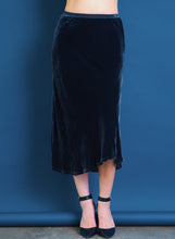 Load image into Gallery viewer, Go velvet underground skirt - Machine washable 82% rayon and 18% silk washed velvet blend skirt with bias cut and an asymmetrical seamed hem. This item also has a velvet elastic waistband at a midi length. 