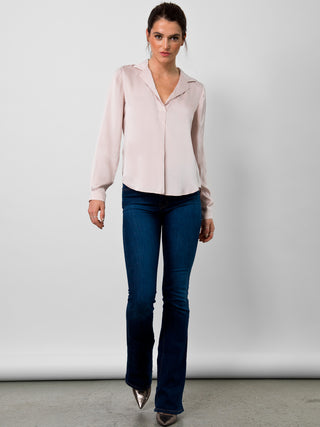 Go luxe anywhere top - Machine washable pull over silk charmeuse top with stylized notch collar neckline, box pleat front detail and long sleeves with barrel button through cuffs. It features back yoke inverted pleat and a self locker loop back detail with high/low shirttail hem. 