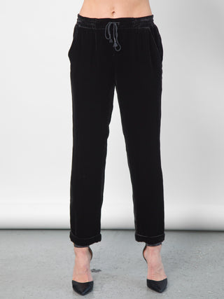 Go velvet everyday pants - Hand wash or dry cleanable 82% rayon and 18% silk velvet pull on mixed pants with silk drawstring cord at waist with self tassel. It has an elastic waistband that sits just below the natural waist with a 9 inch rise. It has front slit pockets with a tapered leg and cuffed hems, its at a 25 inch inseam based on a size small. 