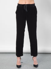 Load image into Gallery viewer, Go velvet everyday pants - Hand wash or dry cleanable 82% rayon and 18% silk velvet pull on mixed pants with silk drawstring cord at waist with self tassel. It has an elastic waistband that sits just below the natural waist with a 9 inch rise. It has front slit pockets with a tapered leg and cuffed hems, its at a 25 inch inseam based on a size small. 