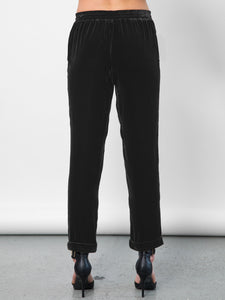 Go velvet everyday pants - Hand wash or dry cleanable 82% rayon and 18% silk velvet pull on mixed pants with silk drawstring cord at waist with self tassel. It has an elastic waistband that sits just below the natural waist with a 9 inch rise. It has front slit pockets with a tapered leg and cuffed hems, its at a 25 inch inseam based on a size small. 