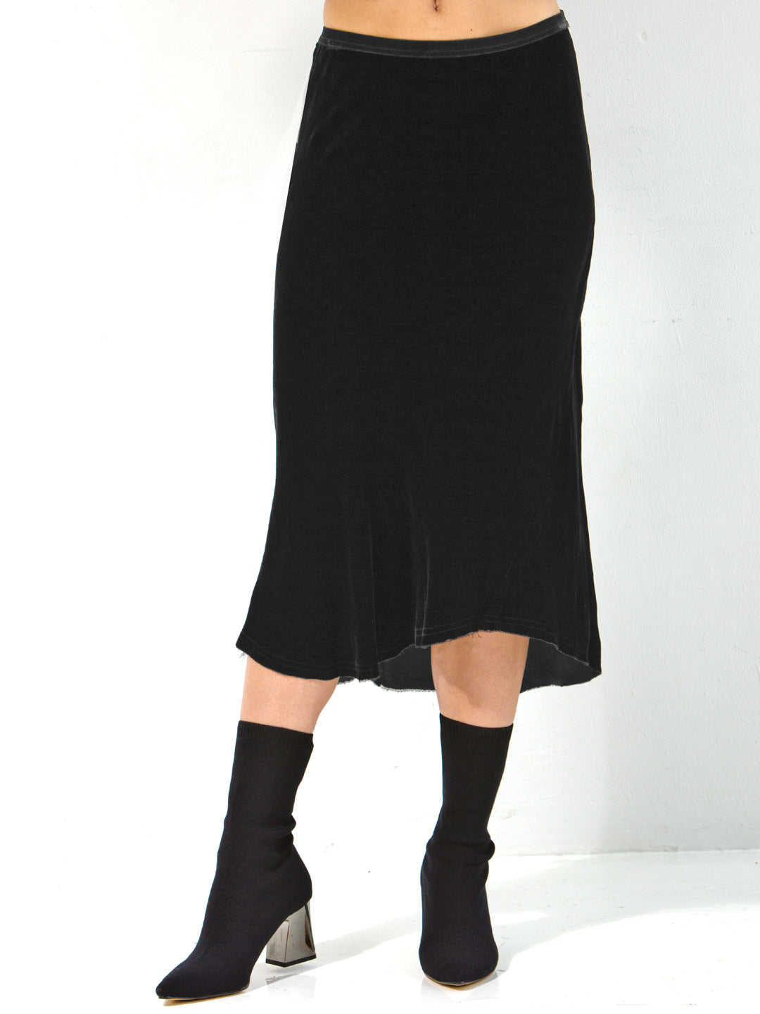 Go velvet underground skirt - Machine washable 82% rayon and 18% silk washed velvet blend skirt with bias cut and an asymmetrical seamed hem. This item also has a velvet elastic waistband at a midi length. 