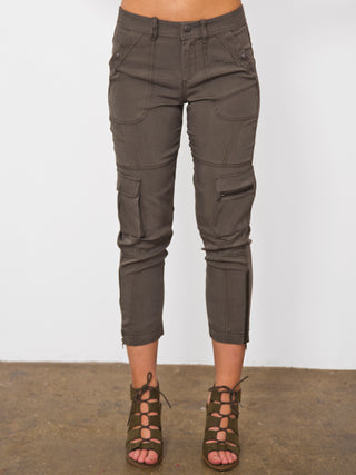 ICONIC go utility pant - Machine washable silk and spandex blend pants with banded waist that sits just below the natural waist at a 9.5 inch rise on a size 4. It has a zip fly snap closure with multiple pocket detailing and burnished hardware trim and cropped skinny-leg fit. It has a zip-slit hem and a 26 inch inseam length based on a size 4. 