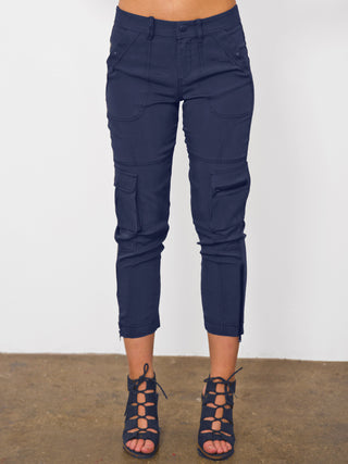 ICONIC go utility pant - Machine washable silk and spandex blend pants with banded waist that sits just below the natural waist at a 9.5 inch rise on a size 4. It has a zip fly snap closure with multiple pocket detailing and burnished hardware trim and cropped skinny-leg fit. It has a zip-slit hem and a 26 inch inseam length based on a size 4. 