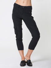 Load image into Gallery viewer, ICONIC go utility pant - Machine washable silk and spandex blend pants with banded waist that sits just below the natural waist at a 9.5 inch rise on a size 4. It has a zip fly snap closure with multiple pocket detailing and burnished hardware trim and cropped skinny-leg fit. It has a zip-slit hem and a 26 inch inseam length based on a size 4. 