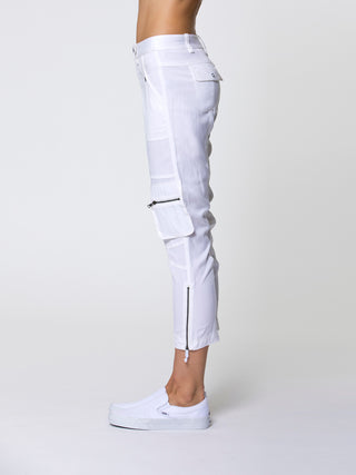 ICONIC go utility pant - Machine washable silk and spandex blend pants with banded waist that sits just below the natural waist at a 9.5 inch rise on a size 4. It has a zip fly snap closure with multiple pocket detailing and burnished hardware trim and cropped skinny-leg fit. It has a zip-slit hem and a 26 inch inseam length based on a size 4. 