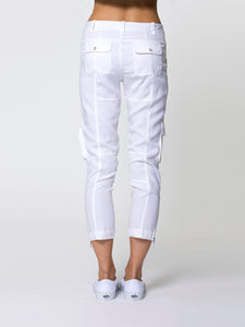 ICONIC go utility pant - Machine washable silk and spandex blend pants with banded waist that sits just below the natural waist at a 9.5 inch rise on a size 4. It has a zip fly snap closure with multiple pocket detailing and burnished hardware trim and cropped skinny-leg fit. It has a zip-slit hem and a 26 inch inseam length based on a size 4. 